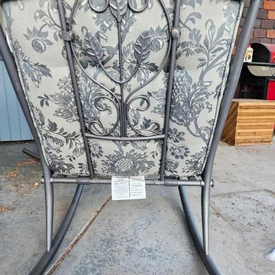 Two metal framed -Grey outdoor rocking chairs with wooden table