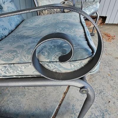 Two metal framed -Grey outdoor rocking chairs with wooden table