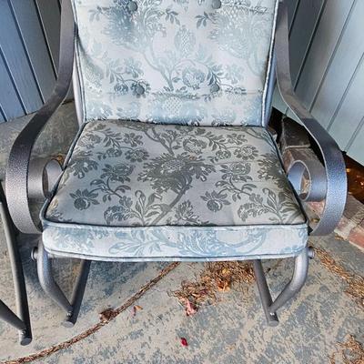 Two metal framed -Grey outdoor rocking chairs with wooden table