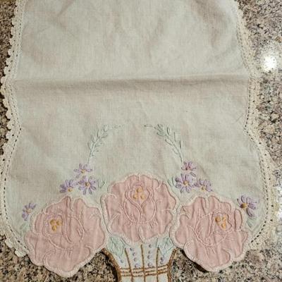 Vintage embroidered kitchen linens and a Royal eight-inch expandable trivet