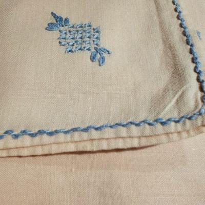 Vintage embroidered kitchen linens and a Royal eight-inch expandable trivet