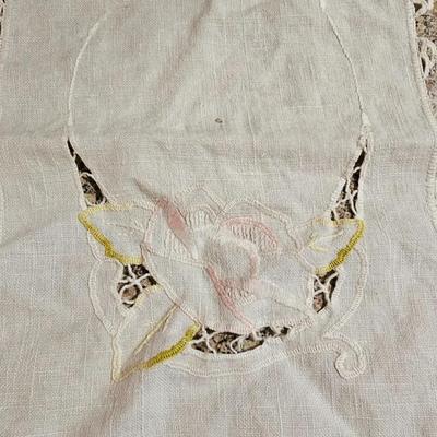Vintage embroidered kitchen linens and a Royal eight-inch expandable trivet