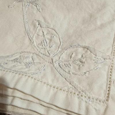 Vintage embroidered kitchen linens and a Royal eight-inch expandable trivet