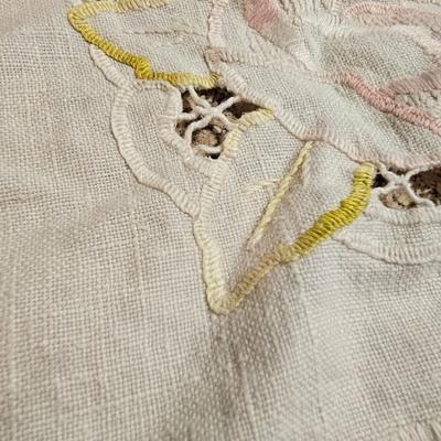 Vintage embroidered kitchen linens and a Royal eight-inch expandable trivet