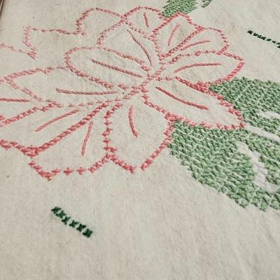 Vintage embroidered kitchen linens and a Royal eight-inch expandable trivet