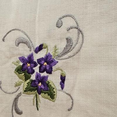 Vintage embroidered kitchen linens and a Royal eight-inch expandable trivet