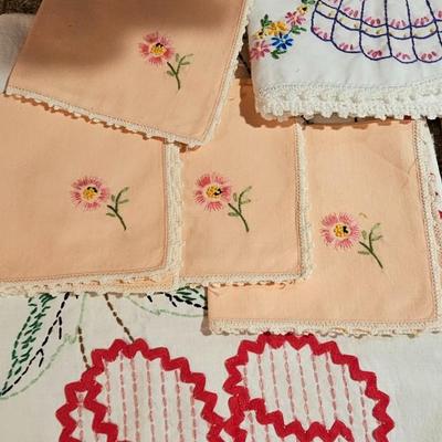 Vintage embroidered kitchen linens and a Royal eight-inch expandable trivet