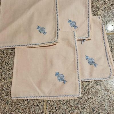 Vintage embroidered kitchen linens and a Royal eight-inch expandable trivet