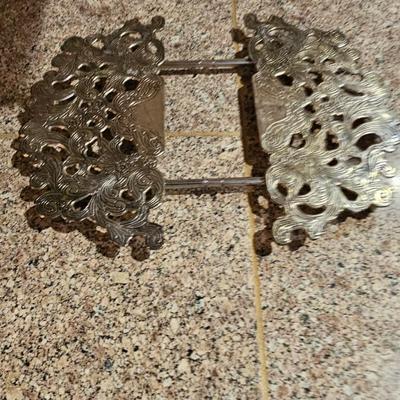 Vintage embroidered kitchen linens and a Royal eight-inch expandable trivet