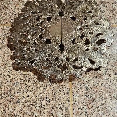 Vintage embroidered kitchen linens and a Royal eight-inch expandable trivet