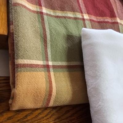 Large variety of rectangle tablecloths and placemats and furniture throws