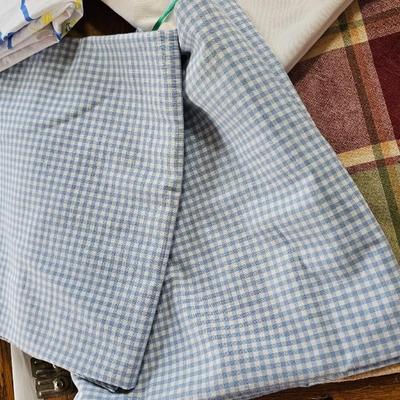 Large variety of rectangle tablecloths and placemats and furniture throws