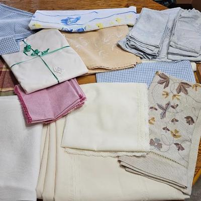 Large variety of rectangle tablecloths and placemats and furniture throws