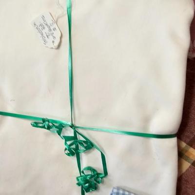 Large variety of rectangle tablecloths and placemats and furniture throws