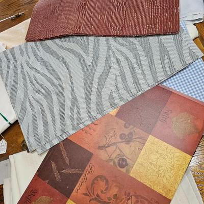 Large variety of rectangle tablecloths and placemats and furniture throws