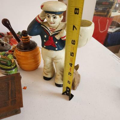 Collectible Lot Cast Iron Cracker Jack Sailor Door Stop Fitz & Floyd Faces, African Wise Monkeys, and other trinkets