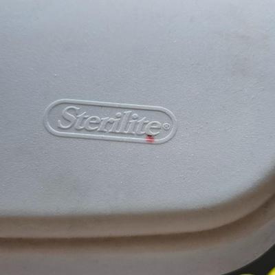 Cleaning supplies and trash can