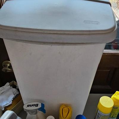 Cleaning supplies and trash can