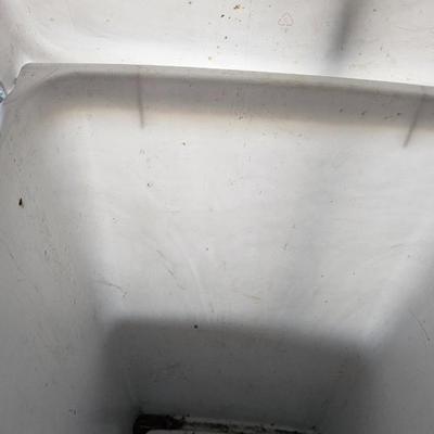 Cleaning supplies and trash can