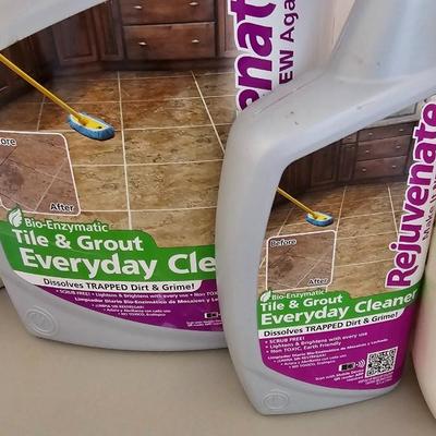 Cleaning supplies and trash can