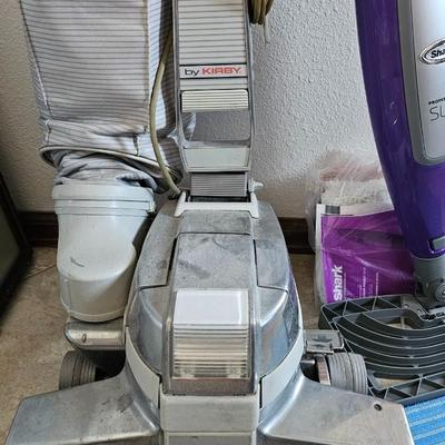 Kirby vacuum and Shark slim steam mop