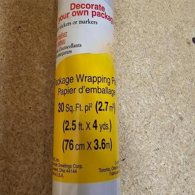 A bunch of Holiday ribbon and wrapping paper and ribbon