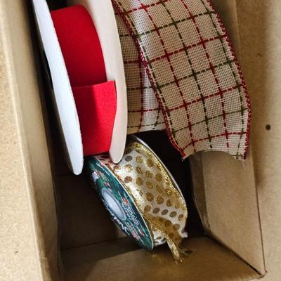 A bunch of Holiday ribbon and wrapping paper and ribbon