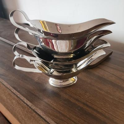Set of stainless steel gravy boats.