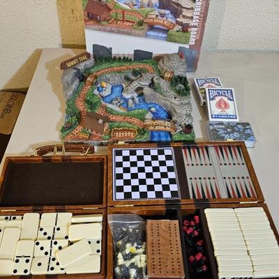 Cool Summit trail cribbage board and an assortment of playing cards and travel games