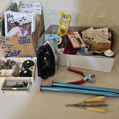 Box of sewing patterns, Singer sewing machine attachments, and assortment of other sewing needs