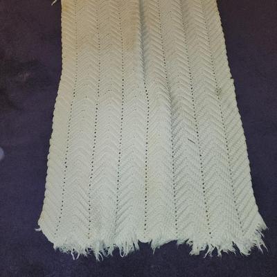 Pair of white woven rugs.