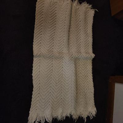Pair of white woven rugs.