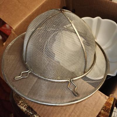 Box of kitchen pans and more.