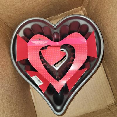 Box of kitchen pans and more.
