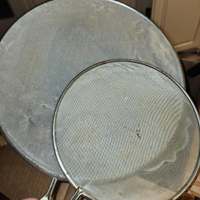 Box of kitchen pans and more.