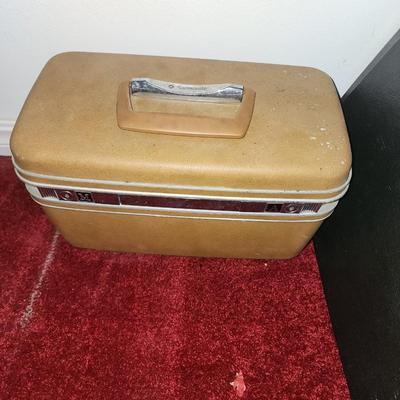 Makeup case and brief case.