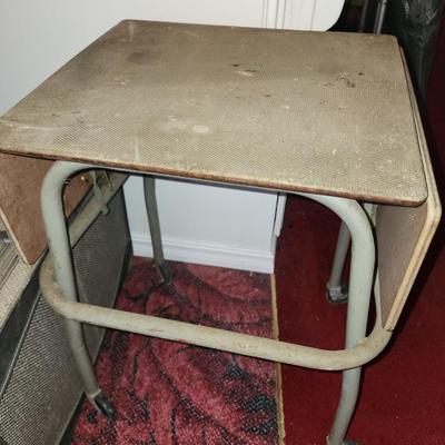 Folding table on wheels.