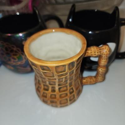 Cat mugs and a nutty one.
