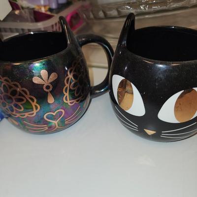 Cat mugs and a nutty one.