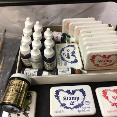 Stamp Pads With Ink, Water Colors Sets, and Paint Brushes.