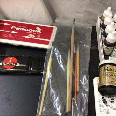 Stamp Pads With Ink, Water Colors Sets, and Paint Brushes.