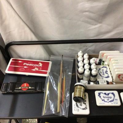 Stamp Pads With Ink, Water Colors Sets, and Paint Brushes.