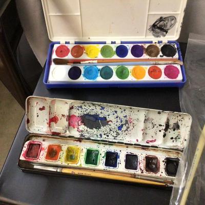 Stamp Pads With Ink, Water Colors Sets, and Paint Brushes.