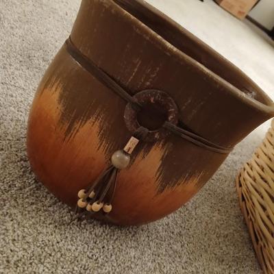 Grouping of wicker baskets and Doilies with pottery vase