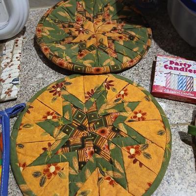 Assortment of Kitchen items - Hot pads - wall clock - plastic food storage and more