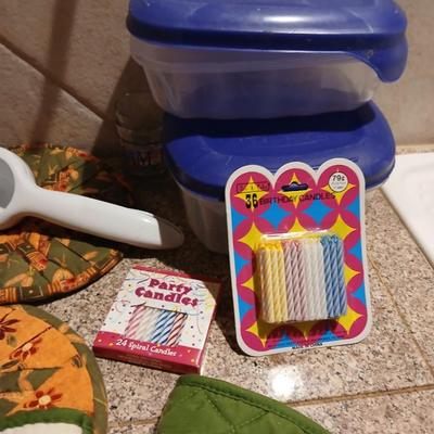 Assortment of Kitchen items - Hot pads - wall clock - plastic food storage and more