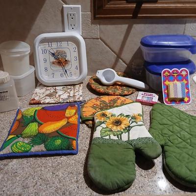 Assortment of Kitchen items - Hot pads - wall clock - plastic food storage and more