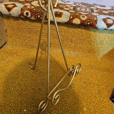 Assortment of framed artwork, picture frames, and photo album books