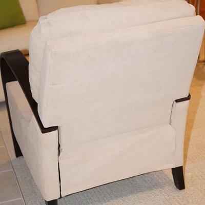 Comfortable chair with slight reclines with footrest. Bentwood Arms of wood