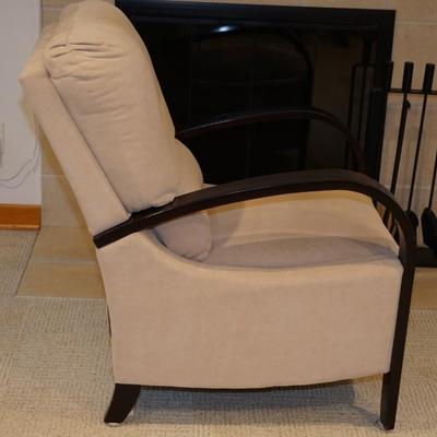 Comfortable chair with slight reclines with footrest. Bentwood Arms of wood
